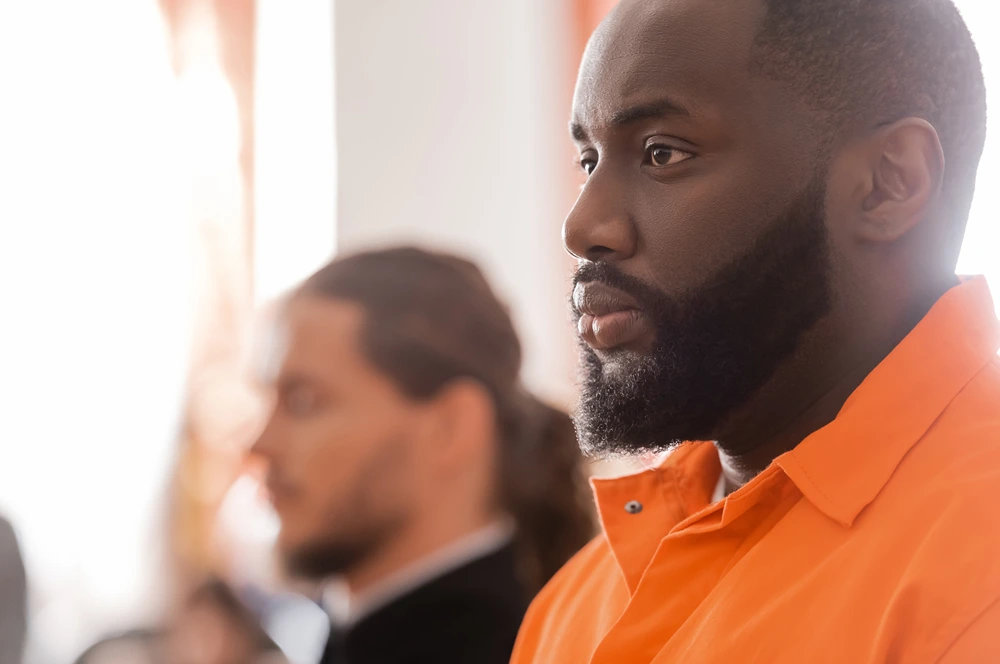 man with beard wearing orange shirt